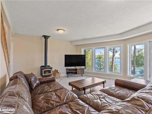 1397 Port Cunnington Road, Dwight, ON - Indoor Photo Showing Living Room With Fireplace