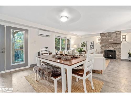 76 Hunts Road, Huntsville, ON - Indoor Photo Showing Dining Room With Fireplace