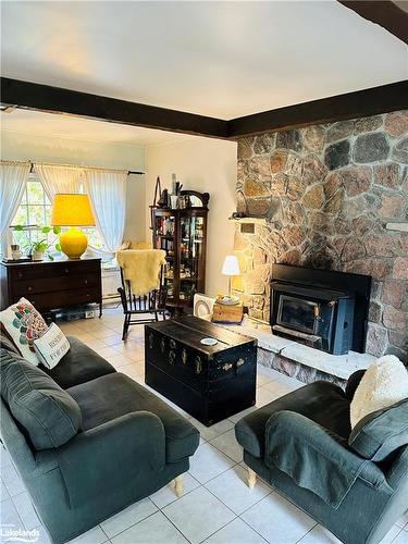 1113 Moon River Road, Bala, ON - Indoor Photo Showing Living Room With Fireplace