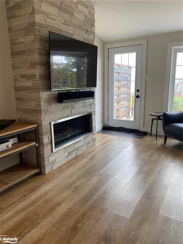 6-139 Lakeshore Road E, The Blue Mountains, ON - Indoor Photo Showing Living Room With Fireplace