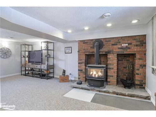 16 Leisure Court, Coldwater, ON - Indoor With Fireplace