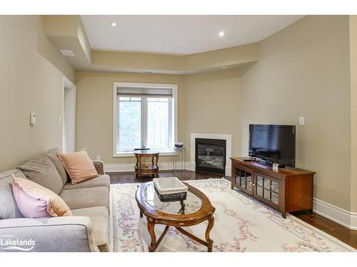 402-391B Manitoba Street, Bracebridge, ON - Indoor Photo Showing Living Room With Fireplace