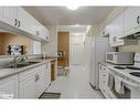 104-333 Lafontaine Road W, Tiny, ON  - Indoor Photo Showing Kitchen With Double Sink 