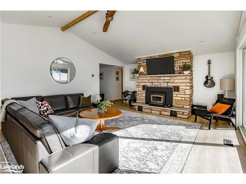 68 Second Street, Tiny, ON - Indoor Photo Showing Living Room With Fireplace