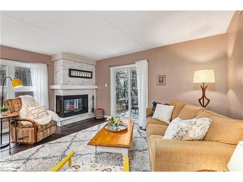 390 Mariners Way, Collingwood, ON - Indoor Photo Showing Living Room With Fireplace