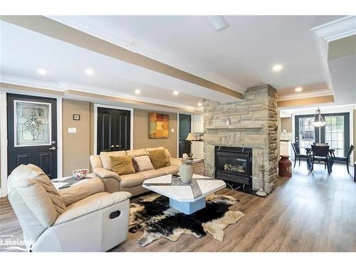Lower-15 Waterview Road, Tiny, ON - Indoor Photo Showing Living Room With Fireplace