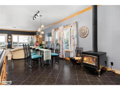 494 Swalwell Drive, Powassan, ON - Indoor Photo Showing Dining Room With Fireplace