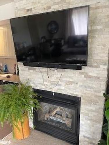 55-106-1235 Deerhurst Drive, Huntsville, ON - Indoor Photo Showing Living Room With Fireplace