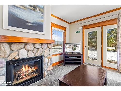 109-184 Snowbridge Way, The Blue Mountains, ON - Indoor Photo Showing Living Room With Fireplace