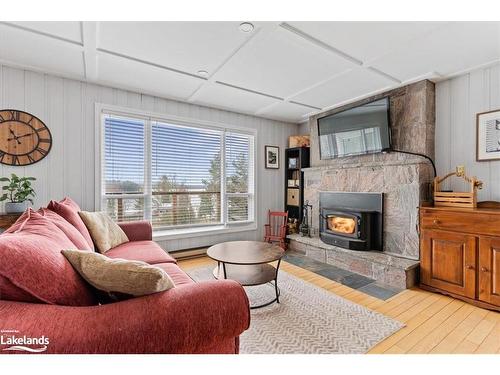 1023 Cove Road, Utterson, ON - Indoor Photo Showing Living Room With Fireplace