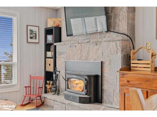 1023 Cove Road, Utterson, ON - Indoor Photo Showing Living Room With Fireplace