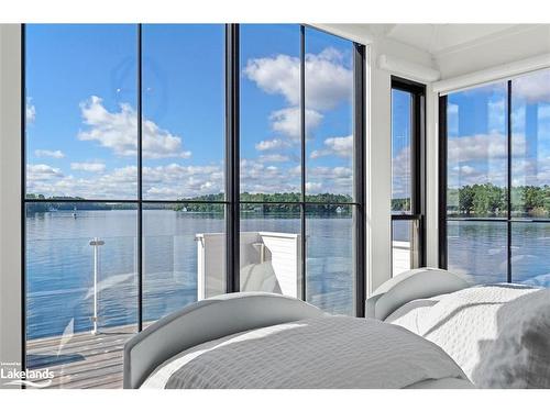 5-1140 Morinus Road, Port Carling, ON - Indoor Photo Showing Bedroom With Body Of Water