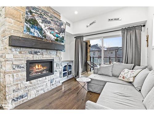 201-10 Beckwith Lane, The Blue Mountains, ON - Indoor Photo Showing Living Room With Fireplace