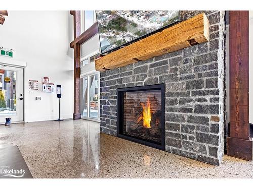 201-10 Beckwith Lane, The Blue Mountains, ON - Indoor Photo Showing Other Room With Fireplace