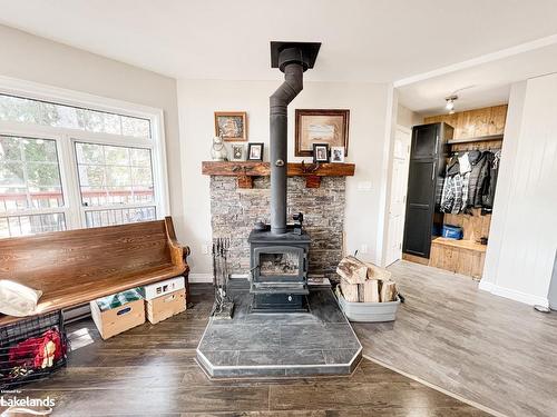 400C Whitestone Lake Road, Whitestone, ON - Indoor Photo Showing Living Room With Fireplace