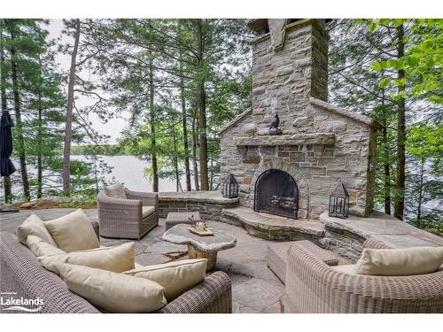 0 M  (Mossy Rock) Island, Port Carling, ON -  Photo Showing Living Room With Fireplace