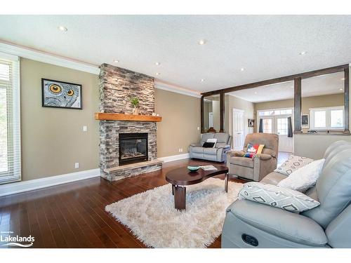 58 Bellehumeur Road, Tiny, ON - Indoor Photo Showing Living Room With Fireplace