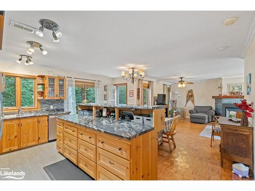 1033 Whites Road, Port Carling, ON - Indoor Photo Showing Kitchen With Fireplace With Double Sink