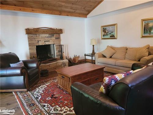 209886 26 Highway, The Blue Mountains, ON - Indoor Photo Showing Living Room With Fireplace