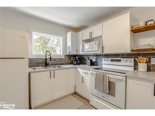 51 Louis Avenue, Tiny, ON - Indoor Photo Showing Kitchen With Double Sink