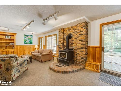 13 Cranbrooke Court, Tiny, ON - Indoor With Fireplace
