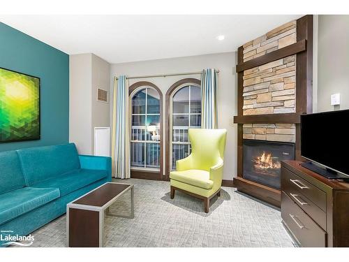 415-190 Jozo Weider Boulevard, The Blue Mountains, ON - Indoor Photo Showing Living Room With Fireplace