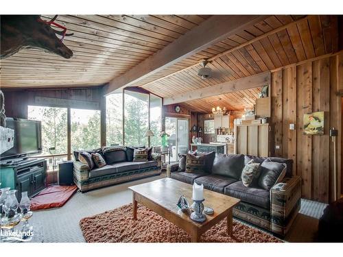 1025 Pratt Road, Muskoka Lakes, ON - Indoor Photo Showing Living Room With Fireplace