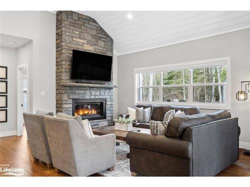 189 Balsam Chutes Road, Port Sydney, ON - Indoor Photo Showing Living Room With Fireplace