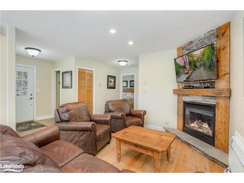 107-3-1052 Rat Bay Road, Lake Of Bays (Twp), ON - Indoor Photo Showing Living Room With Fireplace