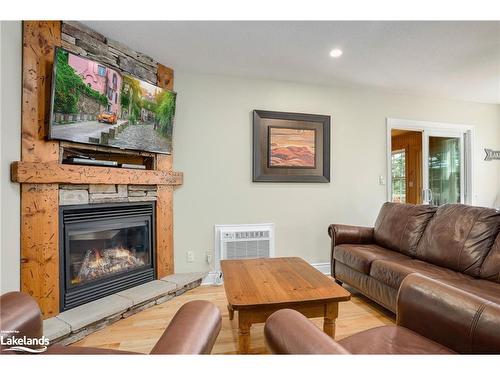 107-3-1052 Rat Bay Road, Lake Of Bays (Twp), ON - Indoor Photo Showing Living Room With Fireplace