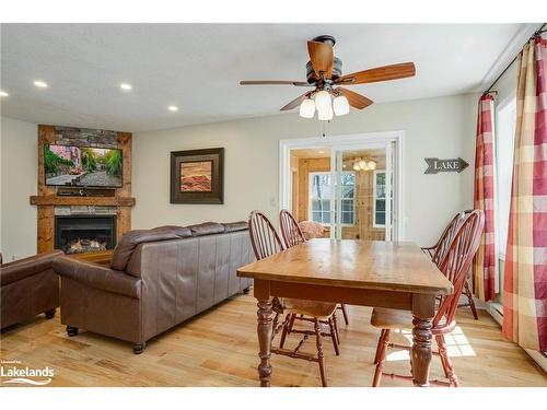 107-3-1052 Rat Bay Road, Lake Of Bays (Twp), ON - Indoor Photo Showing Dining Room With Fireplace