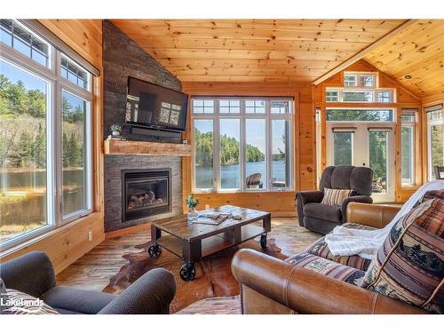 195 Charlies Lane, Huntsville, ON - Indoor Photo Showing Living Room With Fireplace