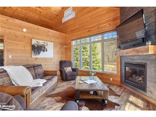 195 Charlies Lane, Huntsville, ON - Indoor Photo Showing Living Room With Fireplace