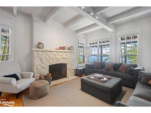 24 J9 Cameron Island, Muskoka Lakes, ON - Indoor Photo Showing Living Room With Fireplace