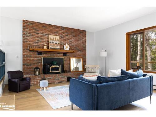 1001 Hemlock Road, Huntsville, ON - Indoor Photo Showing Living Room With Fireplace