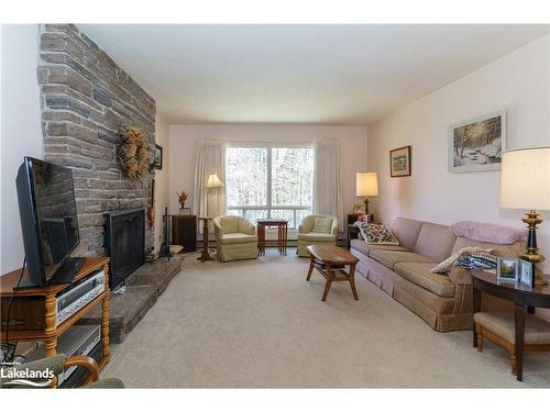 56 Hanes Road, Huntsville, ON - Indoor Photo Showing Living Room With Fireplace