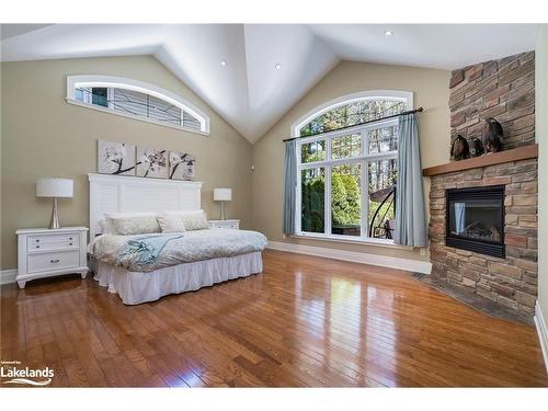 117 Earl Street, Wasaga Beach, ON - Indoor Photo Showing Bedroom With Fireplace