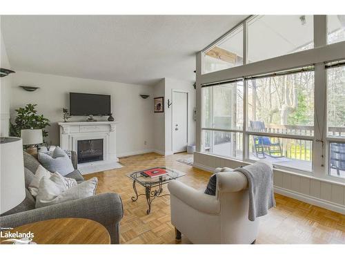 19 Pine Needles Drive, Tiny, ON - Indoor Photo Showing Living Room With Fireplace