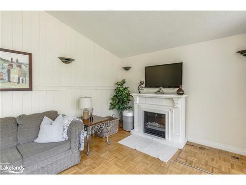 19 Pine Needles Drive, Tiny, ON - Indoor Photo Showing Other Room With Fireplace