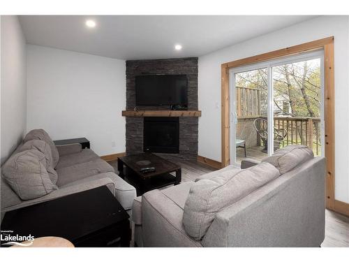 210 Arlberg Crescent, The Blue Mountains, ON - Indoor Photo Showing Living Room With Fireplace