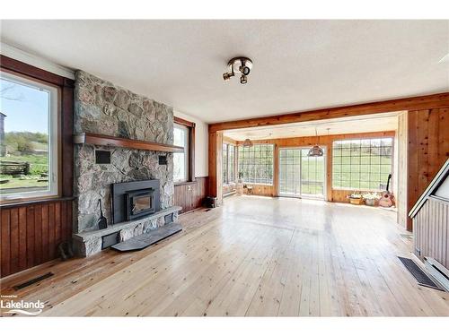 556341 6Th Line, The Blue Mountains, ON - Indoor Photo Showing Living Room With Fireplace