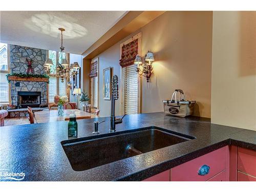 120 Venture Boulevard, The Blue Mountains, ON - Indoor Photo Showing Kitchen With Fireplace With Double Sink