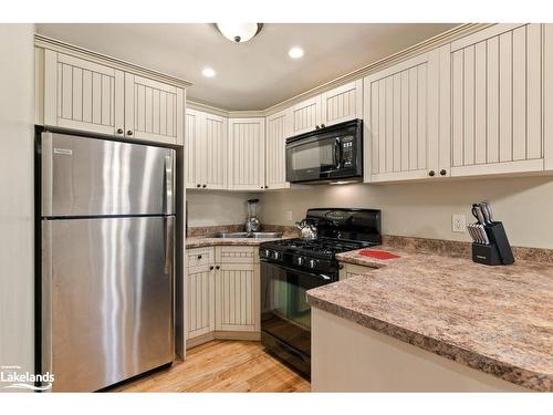 102-9-1052 Rat Bay Road, Lake Of Bays (Twp), ON - Indoor Photo Showing Kitchen With Double Sink