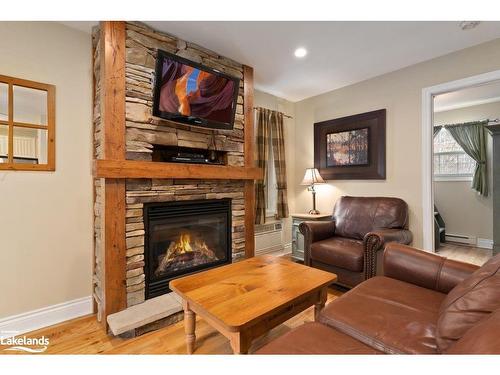 102-9-1052 Rat Bay Road, Lake Of Bays (Twp), ON - Indoor Photo Showing Living Room With Fireplace