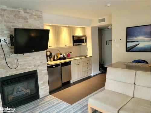 54-207-1235 Deerhurst Drive, Huntsville, ON - Indoor Photo Showing Other Room With Fireplace