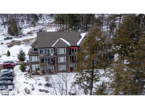 302-3 Tree Tops Lane, Huntsville, ON - Outdoor With Balcony With Facade