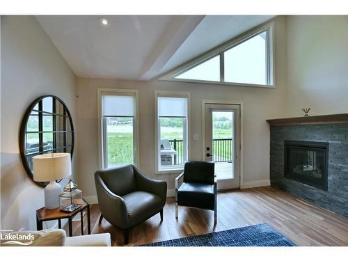 7-106 Alpine Springs Court, The Blue Mountains, ON - Indoor Photo Showing Living Room With Fireplace