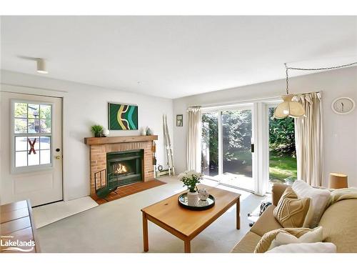 102-23 Dawson Drive, Collingwood, ON - Indoor Photo Showing Living Room With Fireplace