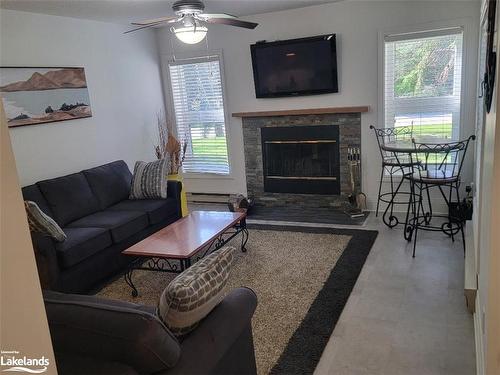 395 Mariners Way, Collingwood, ON - Indoor Photo Showing Living Room With Fireplace