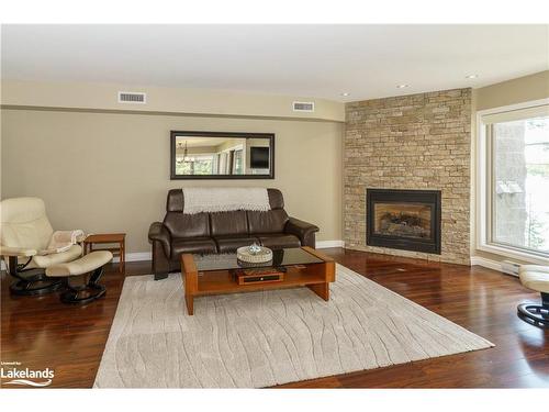 207-10 Coveside Drive, Huntsville, ON - Indoor Photo Showing Living Room With Fireplace